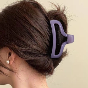 Purple matte fishtail hair claw clip for elegant women styling on long wavy hair