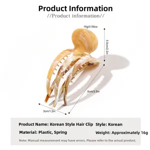 Detailed view of large marble texture hair claw clip showing 9cm size dimensions