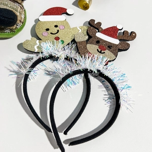 Detail of Christmas headbands featuring glittery gingerbread man and reindeer with tassels