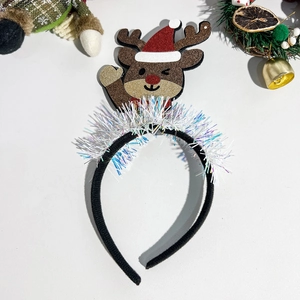 Detail view of sparkly reindeer headband with sequins and festive glitter for Christmas parties