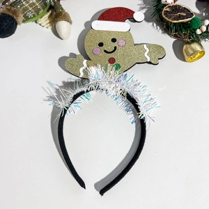Detail of gingerbread man Christmas headband with sequins and festive colorful fringes