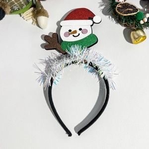 Detail of Christmas headband with a glittery cartoon snowman and shimmering tinsel trim