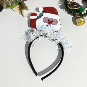 Detail of Christmas headband featuring Santa Claus with sunglasses and glittery red hat