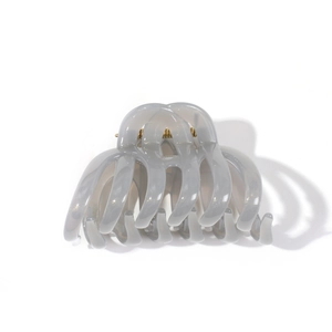 Translucent grey claw clip with glossy finish and gold spring for thick hair