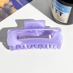 Macro detail of large lavender marble acetate hair claw clip with rectangle design