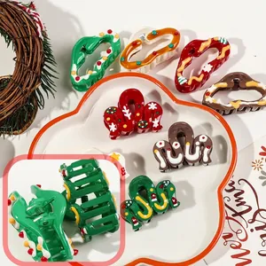 Festive Christmas wave hair claws with colorful painted ornaments and holiday vibes