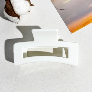 Detailed view of an 8.5cm white rectangular matte resin hair claw clip for women