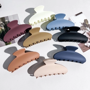 Detailed collection of matte finish crescent hair claws in eight vibrant colors for styling
