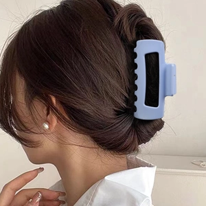 Matte light blue hollow rectangular shark hair claw clip worn on hair for Korean style