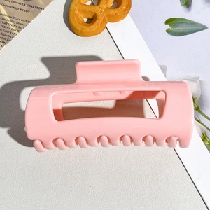 Pink matte large rectangular hair claw clip with smooth rounded teeth for easy hairstyling