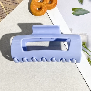 Detail view of large lavender matte soft silicone shark hair claw clip with rounded teeth