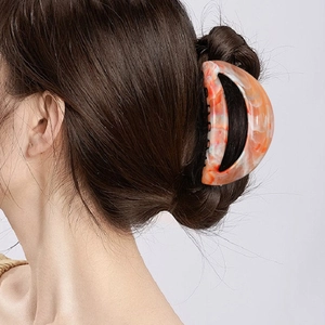 Large marble pattern hair claw clip with orange and pink swirl design for thick hair