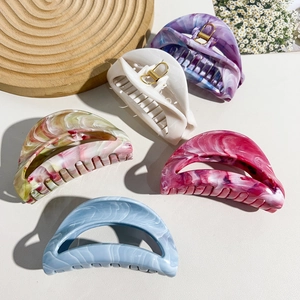 Set of five colorful marble patterned shark hair clips with golden metal springs