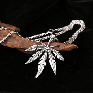 Retro stainless steel maple leaf pendant with textured veins on thick wheat chain