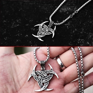 Detailed close-up of Viking Odin Horns pendant with intricate Celtic knot patterns