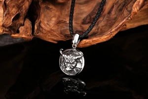 Macro detail of retro stainless steel bull head pendant with vintage blackened finish
