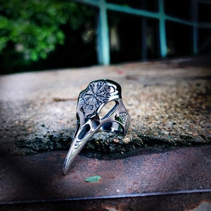 Detail of Viking raven skull ring featuring Vegvisir and Valknut engraved symbols