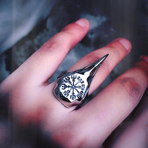 Detail of Viking bird skull ring in vintage stainless steel with Vegvisir symbol engraving