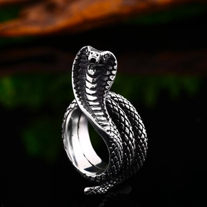 Detailed macro view of an intricate stainless steel cobra snake ring with realistic scales