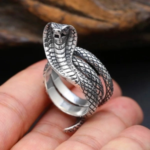 Detailed view of cobra snake ring featuring intricate scale textures in vintage silver