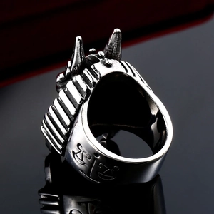 Detailed close-up of retro stainless steel wolf ring with engraved balance scale symbol