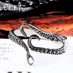 Macro detail of vintage silver octopus tentacle ring with intricate suction cup texture