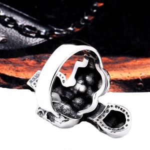 Macro shot of gothic relief details and vintage textured interior on this steel skull ring