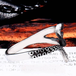 Vintage octopus tentacle ring in stainless steel with detailed suction cups and punk style