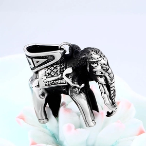 Retro stainless steel elephant pendant necklace with vintage floral carvings on white background