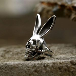 Macro shot of gothic skull ring with rabbit ears in antique silver stainless steel