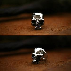 Macro shot of silver skull ring with gothic relief and detailed metallic textures