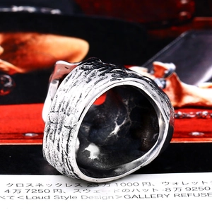 Macro view showing the thick texture and vintage forged detail of this men's gothic ring