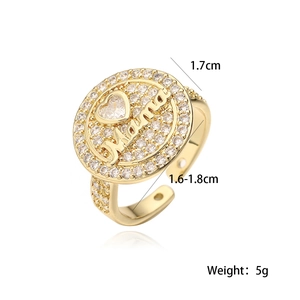 Detailed macro view of 18K gold plated Mama ring with zircon heart and size dimensions