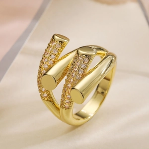 Macro shot of 18k gold plated triple-layer geometric ring with pavé zircon settings