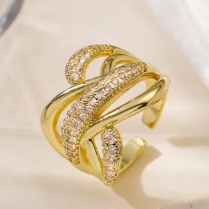 Macro view of gold-plated multi-layer intertwined ring with shimmering zircon stones