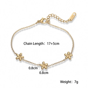 Detail view of 18K gold plated flower bracelet showing S. STEEL hallmark and lobster clasp