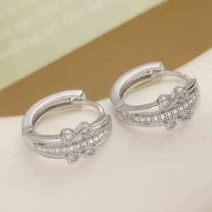 Silver bow hoop earrings with micro-paved zircons and 18K gold plated copper base