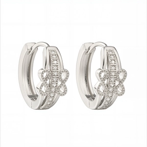 Minimalist silver geometric hoop earrings featuring 18K white gold plating and cubic zirconia