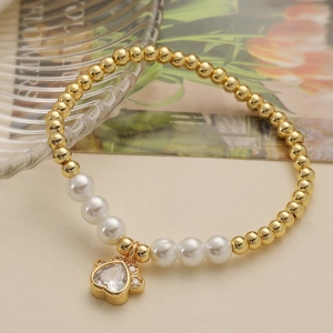 Elegante 18K vergulde kralenarmband met parelaccenten en hondenpoot hartvormige hanger