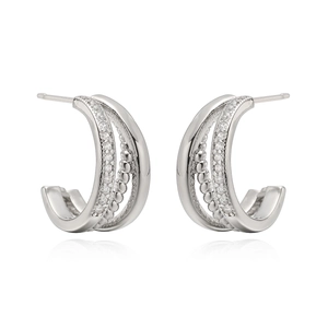 Detailed view of 18K gold plated C-shaped earrings with zircon inlay and beaded texture