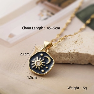 Detail shot of celestial sun and moon pendant showing 2.1cm height and 50cm chain length