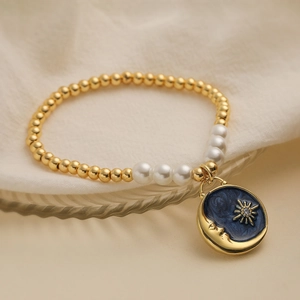 Bohemian 18K gold plated beaded bracelet with celestial moon sun enamel charm and pearls