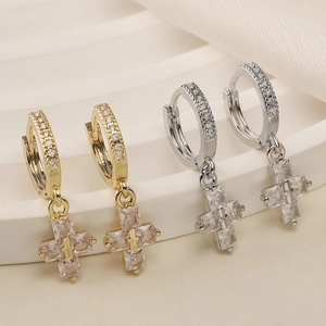 Cross drop earrings in 18K gold and silver plating with cubic zirconia on beige steps