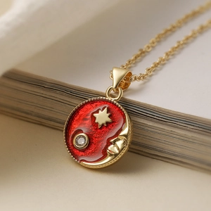 Vintage gold plated sun moon star pendant necklace with red enamel and zircon detail