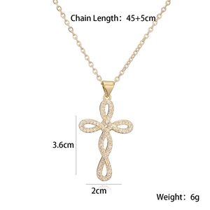 Gold-plated 18K cross pendant necklace with sparkling cubic zirconia on white background