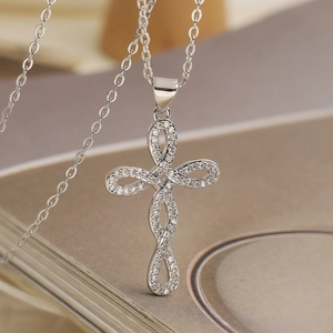 Cross pendant necklace with 18K gold plated infinity design and white zircon stones