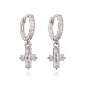 Macro shot of 18K gold plated silver cross drop earrings with sparkling zircon stones