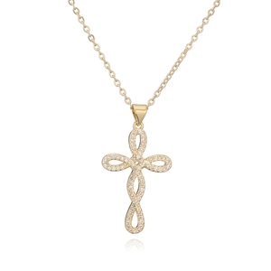 Close-up of 18K gold plated cross pendant necklace with sparkling pavé cubic zirconia