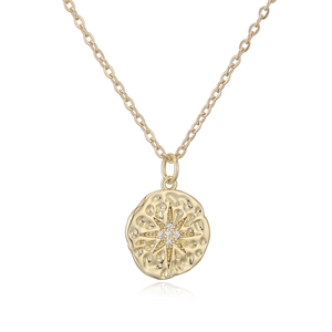 Detail of 18K gold plated pendant with hammered texture and star zircon inlay