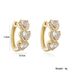 Detail view of 18K gold plated hoop earrings with heart-shaped zircon and 1.4cm dimensions